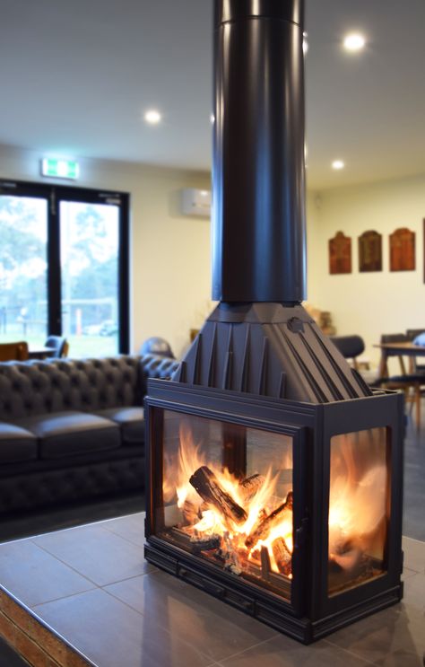 Australia's first FOUR sided wood heater, beautiful from all angles. With its pure cast iron construction, two swinging glass doors and two glass sides, gazing through the dancing flames of the mesmerising Seguin Multivision 8000 cheminee wood fireplace is sure to please all viewpoints no matter of its location. Corner Log Burner, Build A Fireplace, Fireplace Logs, Wood Heater, Freestanding Fireplace, Glass Fireplace, Stove Fireplace, Wood Fireplace, Indoor Fireplace