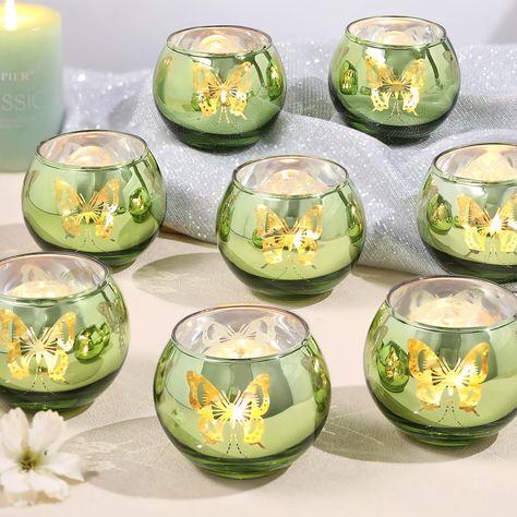 PRICES MAY VARY. ❤️Green Votive Candle Holders-Perfect for Vintage Home Decor and Green Wedding Theme Parties: This glass votive candle holder with unique butterfly pattern is of high quality. When lit, it projects beautiful butterfly light, creating a dreamy and charming atmosphere for you. ❤️Perfect Green Candleholders Decoration：Use this green candle holder at your wedding or dining table, with beautiful butterflies dancing, creating a romantic and unique atmosphere for you. It is especially Fairy Tea Party Table Decor, Wedding Decorations Olive Green, Enchanted Forest Theme Table Decor, Princess And The Frog Sweet 16 Decor, Victorian Tea Party Decorations, Quince Butterfly Theme Centerpieces, Tangled Decorations Party, Quinceanera Decorations Green, Sage Green Centerpieces Quince