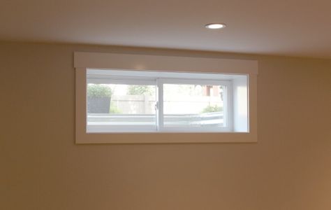 Nice simple trim on this basement window. Pictures of their house redo as well. Basement Windows, Basement Window Coverings, Basement Window Curtains, Basement Window Treatments, Small Window Treatments, Basement Window, Custom Window Coverings, Basement Floor Plans, Basement Apartment