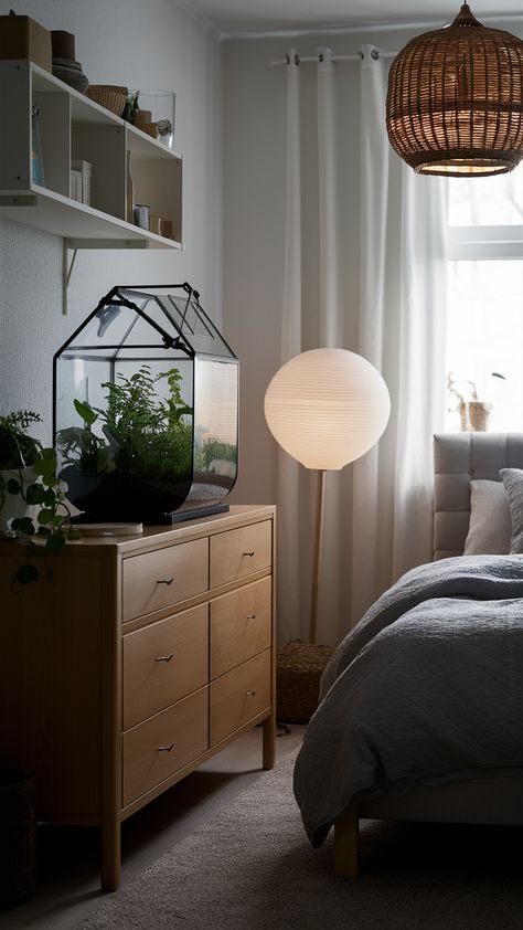 Discover how to create a tranquil bedroom retreat with stunning terrariums styled on a sleek MALM dresser. Paired with a cozy HEMNES bedframe and a minimalist KALLAX shelf unit, this space invites nature indoors. The SINNERLIG bamboo pendant light adds a unique touch, while gentle lighting from the VIDJA floor lamp creates a soothing ambiance perfect for unwinding after a long day. Embrace serenity and elevate your bedroom decor! Click through for more inspiration and tips on incorporating greenery into your space. #BedroomDecor #IKEAStyle #TerrariumLove #HomeInspiration #CozyVibes #InteriorDesign #NatureInspired Malm Dark Brown Bedroom, Malm Nightstand With Legs, Malm Bed Natural, Ikea Malm 3 Drawer Bedside Table, Malm Bedroom, Malm Ikea Bedriom For Boys, Gentle Lighting, Ikea Style, Kallax Shelf Unit