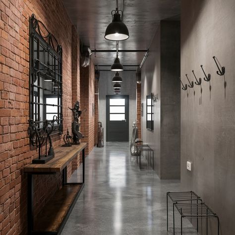 Industrial chic interiors with a cozy twist! What do you think of exposed brick walls? 🏙️💖 #interiordesign #industrialdesign #design #industrialstyle Exposed Brick Salon Spaces, Warehouse Venue Industrial Chic, Cement And Brick Wall, Brick Industrial Interior, Lobby Industrial Design, Industrial Library Design, Concrete Wall Interior Design, Industrial Foyer, Brick Elevation