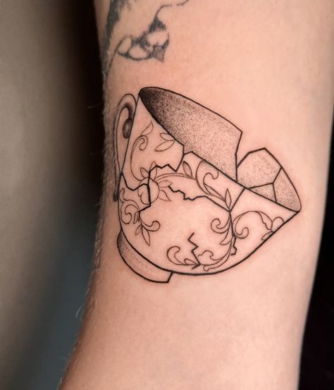 little cracked teapot on the arm, really enjoyed this one 🌝 thank you @_saintsuzanne_ 🫰 Shattered Teacup Tattoo, Alice Teacup Tattoo, Disney Teacup Tattoo, Tea Kettle Tattoo, Tea Tattoo Ideas, Tea Pot Tattoo, Tea Bag Tattoo, Teabag Tattoo, Tea Tattoos