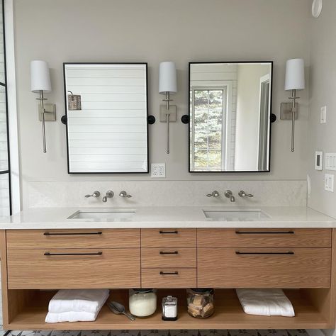 Custom double sink vanity with wood veneer drawers and an open shelf on the bottom for storage, complete with beautiful white quartz countertop and backsplash Design by: Anne Cavan Design Floating Bathroom Vanity Double Sink, Bathroom Floating Vanity, Black Tile Bathrooms, Bathroom Sink Units, Custom Bathroom Cabinets, Bathroom Vanity Drawers, Vanity Backsplash, Bathroom Storage Ideas, Bathroom Ideas Luxury