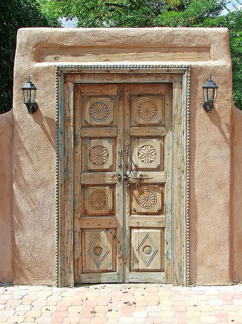 Adobe wall with carved wood garden door.  Southwestern style architecture. Santa Fe Door Mud House, Adobe House, Santa Fe Style, Cob House, Bohol, Garden In The Woods, Old Doors, Garden Doors, Unique Doors