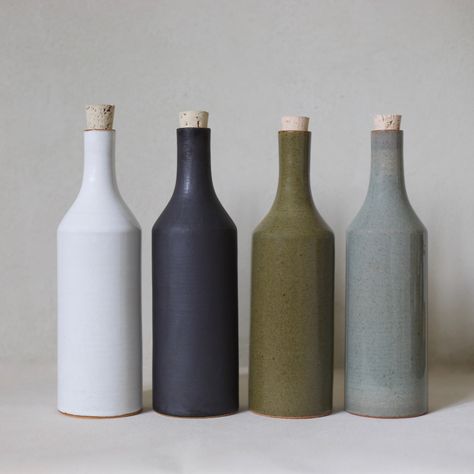 About the product For beverages, flowers, olive oil ~ the Narti Ceramic Bottle with its cork stopper is a standout addition to the kitchen. Available in Brushed White, Dove Green and Dark Ash. about the collection Handcrafted on a human-powered potter's wheel, using raw clay from the mountains of Cambodia, low impact glazes and set in a highly insulated kiln, Cisco & the Sun's 'Earth & Fire' collection has been inspired by and designed using these two raw elements to create a natural ceramic pro Clay Wine Bottle, Ceramic Wine Bottle, Ceramic Pro, Pottery Bottles, Olive Oil Bottle, Natural Ceramic, Dark Ash, Ceramic Bottle, Olive Oil Bottles