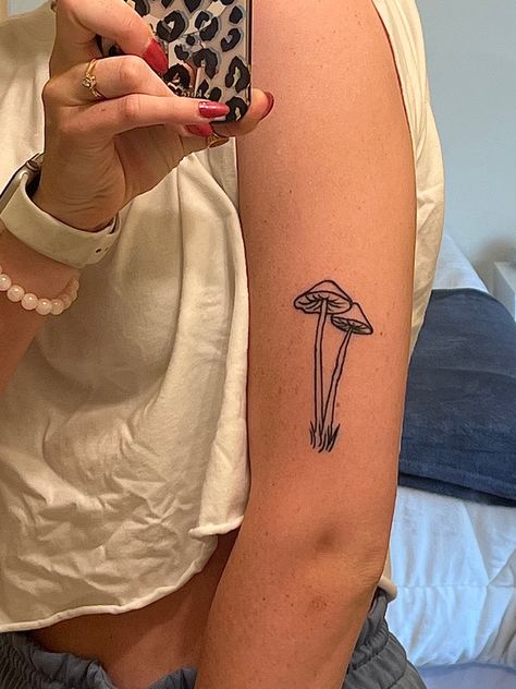 long, thin mushroom tattoo on upper arm Tall Mushroom Tattoo, Mushroom Tattoo Arm, Mushroom Patchwork Tattoo, Long Mushroom Tattoo, Long Stem Mushroom Tattoo, Mushroom Spine Tattoo, Mushroom Line Tattoo, Mushroom Forearm Tattoo, Mushroom Eye Tattoo