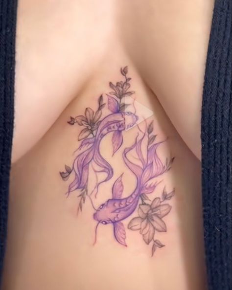 A tattoo of purple koi fish with black flowers surrounding them. Perfect as a sternum tattoo. Sternum Koi Fish Tattoo, Pretty Koi Fish Tattoo, Purple Koi Fish Tattoo, Pretty Eye Tattoo, Koi Fish Sternum Tattoo, Animal Sternum Tattoo, Pink And Purple Tattoo, Japanese Sternum Tattoo, Colored Koi Fish Tattoo