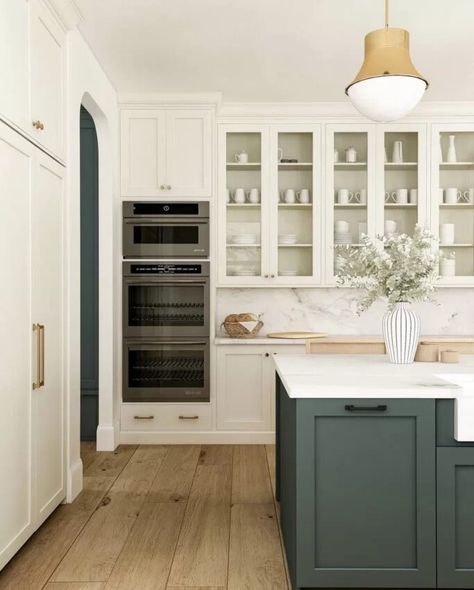 Two toned kitchen cabinets are a gorgeous design trend and we're sharing 17 of our favorite kitchens for inspiration! Two Tone Kitchen Island And Cabinets, Kitchen Inspirations Two Tone, Two Tone Painted Cabinets, Two Tone Kitchen With Island, Wood Cabinets And Floors, Two Tone Green Cabinets, Kitchen Island Different Color Cabinets, Two Colored Cabinets Kitchen, Two Tone Kitchen Cabinets Green And White