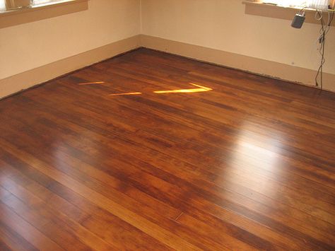 I like this color stain.  He used American walnut stain as a base with some red mahogany dye mixed in Refinished Floors, Fir Floors, Rental Remodel, Bungalow Remodel, Douglas Fir Flooring, Hardwood Flooring Ideas, Oak Timber Flooring, 1920s Bungalow, Table Redo