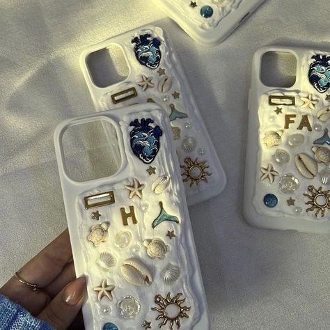 "Introducing latest trend straight out of Pinterest to you all. : custom silicon phone cases adorned with charms and pearls! Personalize yours to reflect your unique style and make your phone truly stand out." DM to order💌 [ phonecase, pinterest, pinterestphonecase, siliconphonecases, pinterestinspired, seashellphonecase] #charmsjewelry #phonecase #pinterest #pinterestphonecase #siliconphonecases #pinterestinspired #pinteresttrending #seashellphonecase Memory Phone Case, Charm Phone Cases Diy, Memor Phone Cases, Charm Phone Cases, Memor Phone Case, Silicon Phone Cases, Seashell Phone Case, Beach Phone Case, Shell Phone Case