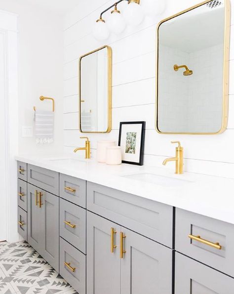 Warm brass hardware complements cool gray cabinetry, creating a fresh and contemporary bathroom design. Gold Bad, Bathroom Cabinets Diy, Shiplap Walls, Gray Vanity, Contemporary Bathroom Designs, Bad Inspiration, Gold Fixtures, Gold Bathroom, Grey Cabinets