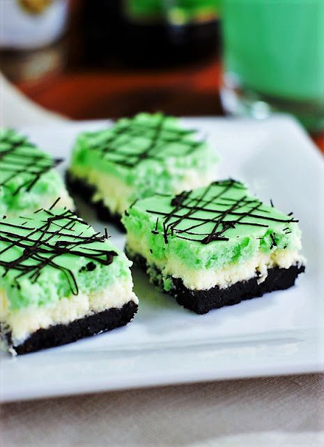 Grasshopper Cheesecake Squares image ~ The classic combination of creme de cacao and creme de menthe with cream {a.k.a. ~ a Grasshopper cocktail} is turned into a beautifully layered cheesecake treat. Grasshopper Cheesecake, New England Boiled Dinner, St Patrick's Day Desserts, Boiled Dinner, Cheesecake Squares, St Patricks Day Food, Sweet Treats Desserts, Baileys Irish Cream, Cheesecake Bars