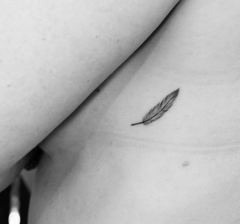 Tiny feather tattoo Tiny Feather Tattoo, Feather Rib Tattoos, Trap Tattoos For Women, Feather Arrow Tattoo, Feather Tattoo Ankle, Small Feather Tattoo, Ear Tattoo Ideas, Petit Tattoo, Finger Tattoo For Women