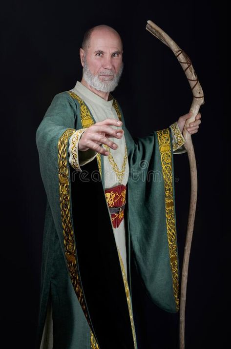 Powerful Wizard Holds A Wooden Magic Staff Stock Image - Image of bald, magic: 209535051 Wizard With Staff Pose, Man Holding Staff Reference, Magic Staff Pose, Wizard Poses Reference Male, Wizard Pose, Celtic Clothes, Saint Painting, Combat Poses, Druid Costume