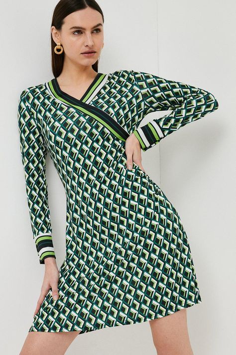 Bringing The Splendour Of The Seventies Straight To Your Closet, This Sleek Wrap Dress Shows Off A Vivid Geometric Print And Sporty Striped Trims. Its Feminine Wrap Shape And V-Neckline Truly Flatter Any Figure. Fitted Green Dress With Geometric Pattern, Spring Mini Dress With Geometric Pattern, Work Outfits Business Casual, Fitted Mini Dress With Geometric Pattern, Geometric Print Fashion, Summer Geometric Pattern Mini Dress, Printed Green Dress, Multicolor Geometric Mini Dress, Jersey Dresses