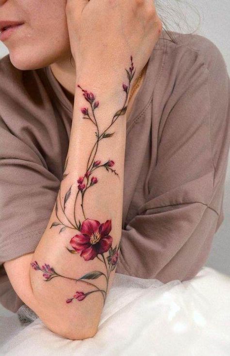 27 Stunning Forearm Tattoos To Vamp Up Your Femininity Forearm Flower Tattoo Women Color, Floral Forearm Tattoo Women Color, Feminine Tattoo Sleeves Non Floral, Leaf Tattoo Forearm, Vintage Floral Tattoos Forearm, Forearm Tattoo Feminine, Vine Flowers Tattoo, Forearm Tattoo Women Flowers, Forearm Flower Tattoo Women