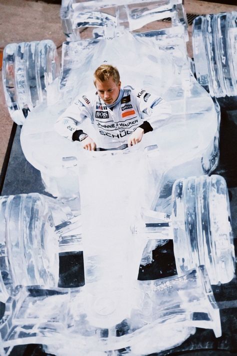 a young kimi raikkonen lowers himself into  a to-scale formula 1 car made completely of ice F1 Poster Design, Kimi Raikkönen, Ice Car, Ice Man, The Iceman, Kimi Raikkonen, Ice Sculpture, F1 Car, Formula 1 Car Racing