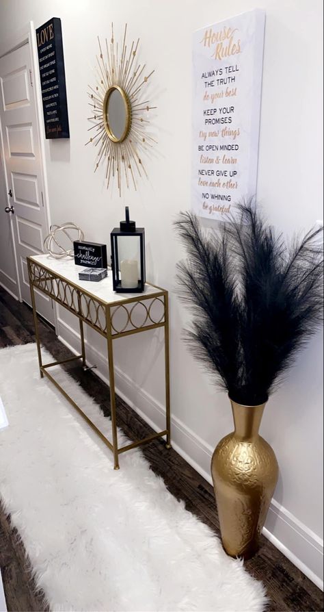 Edgy Chic Home Decor, Vase With Feathers Decor, Aesthetic Hallway Ideas, Glass Entryway Table Decor, Cream House Decor, Living Room Decor For Apartments, Apartment Stairway Decorating, Black And Gold Apartment Decor, Bougie Apartment