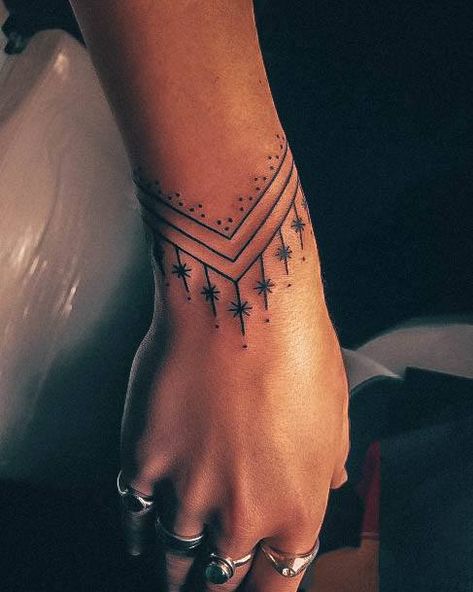 Western Bracelet Tattoo, Womens Band Tattoo, Wrap Tattoos For Women Arm, Wrap Around Wrist Hand Tattoo, Bracelet Hand Tattoo, Bracelet Tattoo Drawing, Women With Arm Tattoos, Boho Finger Tattoos For Women, Ornamental Wrist Cuff Tattoo