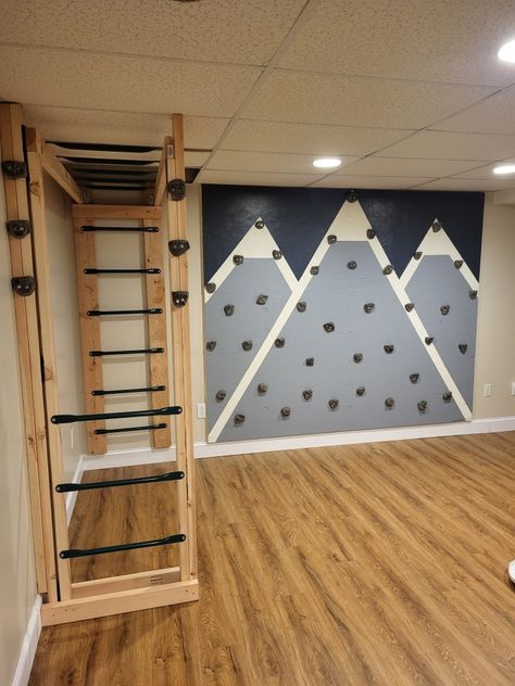 Monkey Bars In Playroom, Basement Rock Wall, Rock Wall Bedroom Ideas, Rock Wall In House, Basement Rock Climbing Wall, Rock Wall Playroom, Basement Monkey Bars, Playroom Rock Climbing Wall, Playroom Rock Wall