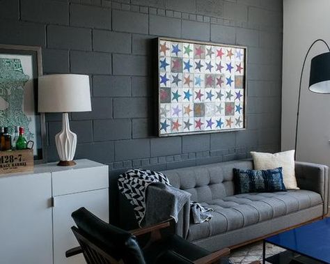 Cinder blocks are an inexpensive, strong and simple material for DIY projects Decorating Cinder Block Walls, Industrial Decor Living Room, Concrete Block Walls, Cinder Block Walls, Black Accent Walls, Grey Couch Living Room, Basement Makeover, Industrial Livingroom, Basement Walls