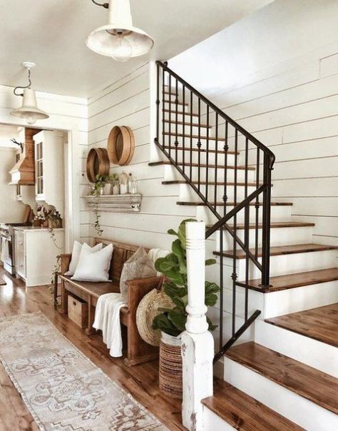 A farmhouse stair railing might not be at the top of your list when refreshing your home, but we think it should be given a higher priority. This small detail can instantly weave vintage charm into your entryway while bringing aesthetic value to your stairwell. #vintage #farmhouse #decor Farmhouse Stair Railing, Farmhouse Entryway Decor, Rustic Farmhouse Entryway, Modern Farmhouse Dining Room, Modern Farmhouse Dining, Farmhouse Entryway, Stair Case, Entryway Ideas, Farmhouse Dining Room