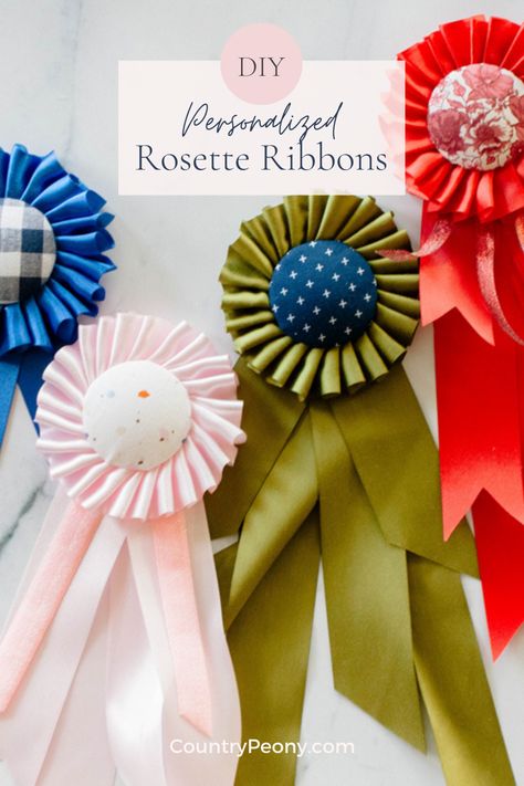 Add a little vintage and personalized charm into your life with these custom rosette ribbons. Today I partnered with Clover to bring you the step-by-step tutorial to make your own rosette ribbons. These make the perfect gift, or are the perfect vintage inspired addition to your home decor. #diyrosetteribbons #rosetteribbons #rosette #diyrosette #homemadegift #diygift Rosette Ribbon Diy, Diy Ribbon Rosette, How To Make A Ribbon Rosette, Ribbon Rosettes Diy, How To Make Rosettes, Diy Rosette, Blue Ribbon Award, Rosette Ribbon, Award Ribbons