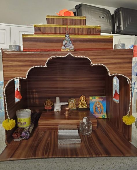 Mandir made with cardboard and adhesive paper which makes the cardboard looks like wood😀 Diy Mandir Ideas Cardboard, Mandir Design, Pooja Mandir, Diy Yarn, Diy Yarn Crafts, Puja Room, Pooja Room, Pooja Rooms, Yarn Diy