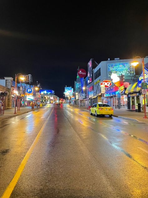 rainy street with taxi with carnival Niagara Falls Aesthetic, Clifton Hill Niagara Falls, Aesthetic Carnival, Rainy Road, 2024 Manifestation, Rainy Street, Clifton Hill, Birthday Weekend, Manifestation Board