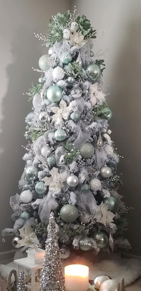 Beautiful icy mint tree! Mint Green Ornaments Christmas Tree, Mint And Gold Christmas Tree, Silver Glitter Christmas Tree, Silver White Green Christmas Tree, White Silver And Green Christmas Tree, White Christmas Tree With Green Ornaments, Sea Foam Christmas Tree, Frost Tree Decorations, Mint And Silver Christmas Tree