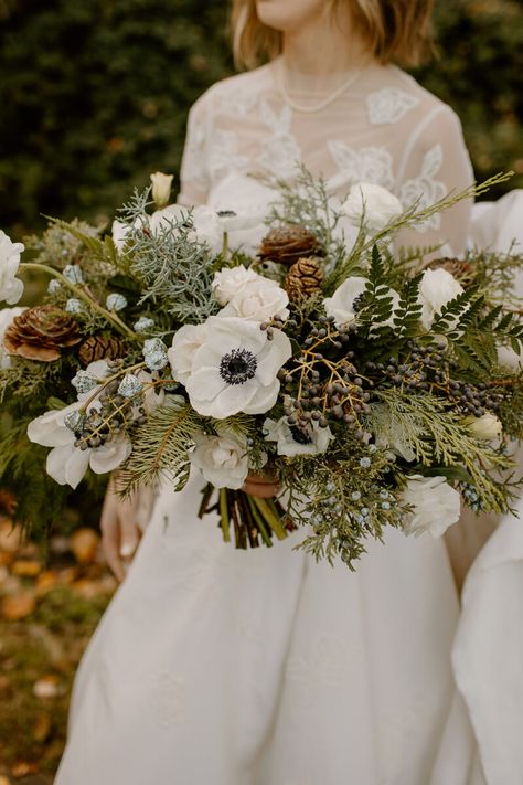 An Evergreen Winter Wedding At Axis Pioneer Square - Flora Nova Design - Premier Event Design Studio in Seattle Wedding Forest Flowers, Bridal Bouquet With Pinecones, Evergreen Bridal Bouquet, Pinecone Wedding Bouquet, Christmas Bouquet Wedding, Juniper Bouquet, Winter Flowers Aesthetic, December Wedding Flowers, Forest Wedding Bouquet