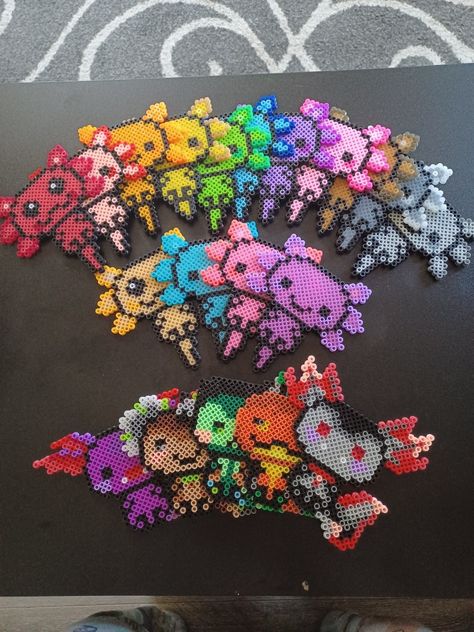 Every axolotl I've created Perler Axolotl, Axolotl Bead Pattern, Axolotl Perler Bead Patterns, Axolotl Perler Beads, Axolotl Pixel Art, Axolotl Craft, Axolotl Party, Mini Hama Beads, Bead Animals