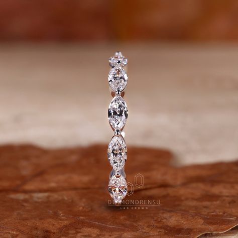 Enhance your wedding set with the Marquise Cut Lab Grown Diamond Half Eternity Wedding Band for Women. Featuring an east to west set marquise lab-created diamond, this matching and stackable band by Diamondrensu adds a touch of elegance and sparkle to your special day. With its exquisite design and ethical sourcing, this wedding band symbolizes everlasting love and commitment. Complete your bridal look with this beautiful handcrafted piece. "𝐓𝐨𝐠𝐞𝐭𝐡𝐞𝐫 𝐰𝐞 𝐜𝐚𝐧 𝐦𝐚𝐤𝐞 𝐭𝐡𝐞 𝐰𝐨𝐫𝐥? Marquee Diamond Wedding Band, Wedding Bands For Women Marquise, Marriage Bands For Women, Wedding Bands Silver Women, Wedding Bands For Marquise Diamond, Marquise Diamond Wedding Band, Marquise Wedding Band Stack, Woman’s Wedding Band, Marquee Wedding Band