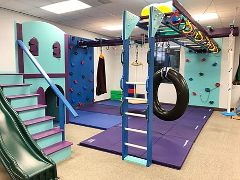 Sensory Gym – Handprints & Footsteps Pediactric Therapy Kids Gym Room Indoor Play, Playroom Gym Ideas, Aba Clinic Decor, Home Gymnastics Room For Kids, Home Sensory Gym, Basement Kids Gym, Sensory Gym At Home, Indoor Trampoline Playroom, Basement Jungle Gym For Kids