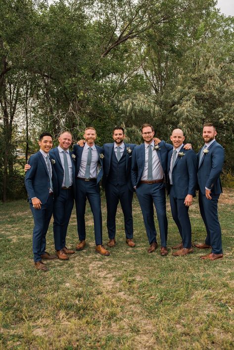 Groomsmen in Navy Blue suits for a dusty blue wedding in Fort Collins, Colorado. #dustybluewedding #navybluesuit #FortCollinsWedding Blue Groomsmen Attire, Navy Blue Groomsmen, Navy Blue Suit Wedding, Blue Groomsmen Suits, Navy Blue Wedding Theme, Blue Groomsmen, Navy Suit Wedding, Wedding Groomsmen Attire, Groom And Groomsmen Suits