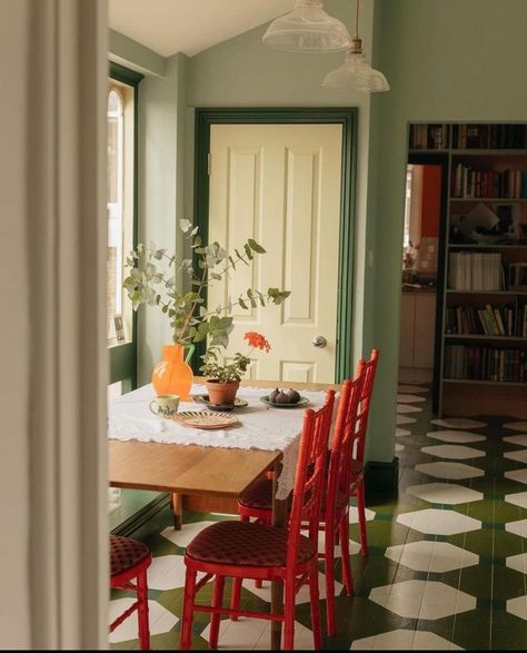 1930s Dining Room, Colorful Dining Room Chairs, Colorful Dining Room, Plate Rack Wall, Yellow Kitchen Cabinets, Painted Dining Table, Calm Color Palette, Plate Rack, Yellow Paint