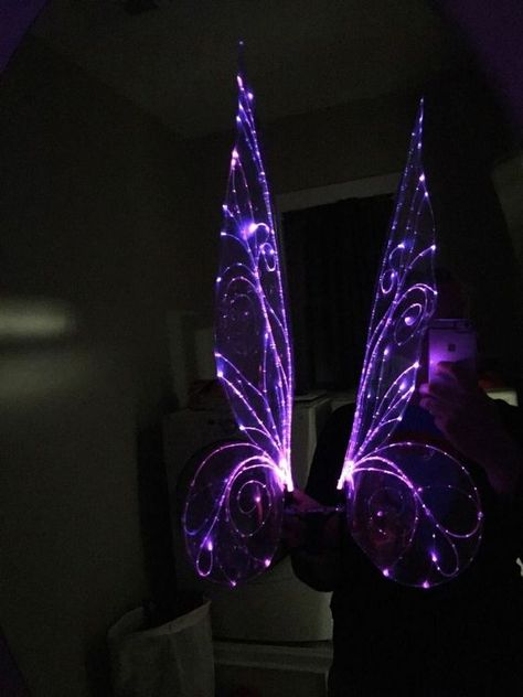 Add some glamour to your fairy costume using fiber optics. This method for light up wings uses a simple circuit of LEDs and a battery to achieve a look a similar to EL wire, but thinner and almost invisible when not lit up. The lighting isn't as even as EL wire because it uses a single light source instead of glowing along its length, but it was an interesting and fun experiment. It would be pretty easy to advance the project by hooking the LEDs up to a LilyPad to create blinking or fading l... Electric Dragon, Fairy Cosplay, Purple Fairy, Simple Circuit, El Wire, Fibre Optics, Wings Costume, Diy Fairy, Fairy Costume