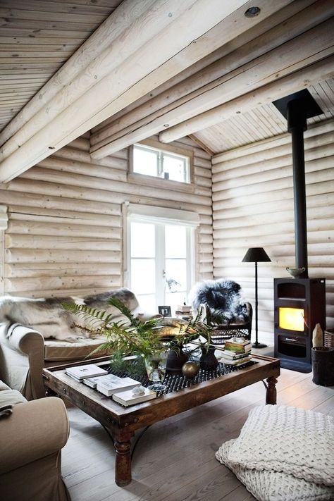 Interiors | Country Retreat | Dust Jacket | Bloglovin’ Dark Log Cabin Homes Interior, Tiny Fireplace, Painted Log Home Interior, Cabin Walls, Norwegian Interior, Norwegian Cabin, Log Home Interior, Interior Cabin, White Cabin