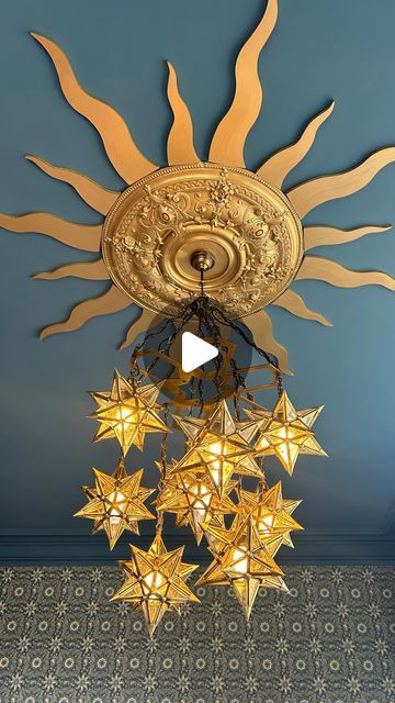 Helena Garcia on Instagram: "I’ve been working on the biggest bedroom in the house for weeks! And although it isn’t quite finished I wanted to show you what I did with the main light fitting.  It seems the Victorians limited their ceiling roses and ornate covings etc to the ground floor as there’s none upstairs but I found this reclaimed one on marketplace for £20! It’s huge but this room is so big it doesn’t look it.  It is a south facing bedroom and incredibly light so I thought it would be nice to represent that with a sun shape ceiling rose 🌞 The paint and wallpaper both came from @warnerhouse_1870 and I have to say that the paint was so thick I only needed to do one coat! With the size and height of this ceiling let me tell you that was a godsend!  I hope you like it ☺️  #interiordes Witchy Ceiling Light, Gold Stars Ceiling, Star Lighting On Ceiling, Fantasy Ceiling Light, Stars Celling Design, Star Ceiling Medallion, Sun Ceiling Design, Apartment Ceiling Light Ideas, Sun Ceiling Light