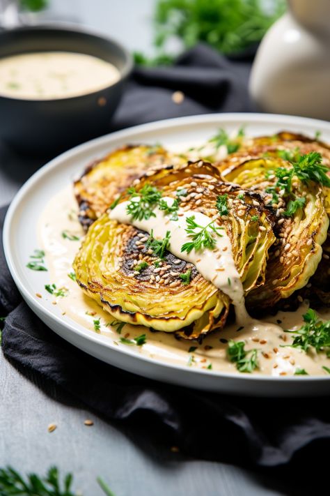 Easy Keto Recipe: Grilled Cabbage Steaks with Tahini Dressing for Healthy Living #ketodiet #ketorecipes #lowcarb Roasted Cabbage With Tahini Sauce, Cabbage Steaks Grilled, Cabbage Tahini, Grilled Cabbage Recipes, Grilled Cabbage Steaks, Cabbage Steak, Spring Dinners, Cabbage Steaks Recipe, Grilled Cabbage