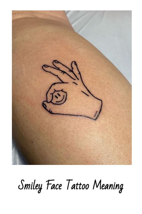 Smiley Face Tattoo Meaning Cool Smiley Face Tattoos, Smile Tatoos Ideas, Tattoo Branding Design, Curved Tattoo Design, Smiley Tattoo Design, Enjoy Life Tattoo, Gta 5 Tattoo, Smile Tattoo Ideas, Graphic Designer Tattoo