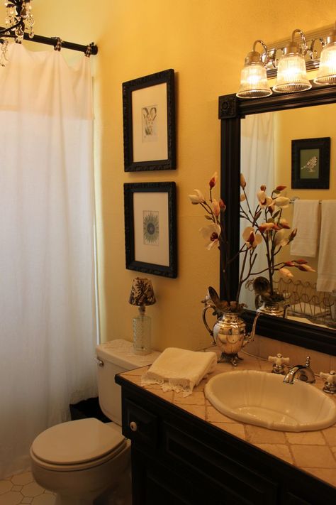 Love the warm wall color with the dark wood.  Beautiful. This shows you how to frame a basic mirror to look like an expensive one! Room Ideas Yellow, Expensive Bathrooms, Bathroom Mirror Makeover, Yellow Bathroom Decor, Brown Bathroom Decor, Yellow Mirrors, Mirror Makeover, Yellow Bathroom, Cottage Bathroom