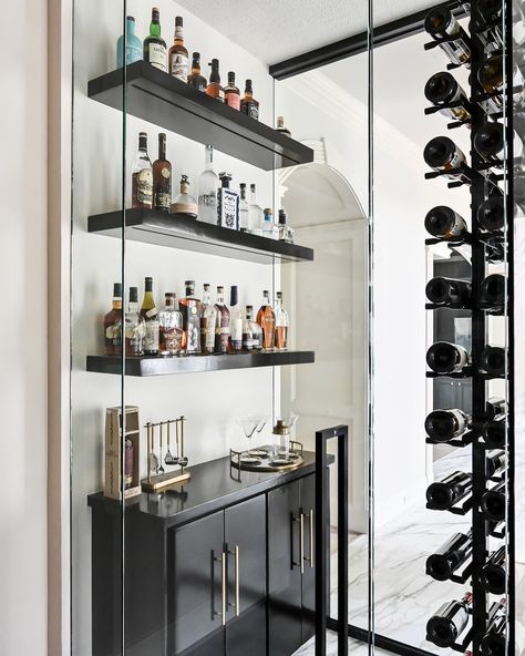 Happy Hour, anyone? // A sleek wine room greets you upon entering the posh dining room of our Woodlands, TX renovation. 🍷 ⠀⠀⠀⠀⠀⠀⠀⠀⠀ Interiors: @bydesigninteriorsinc Photography: @frenchbluephotography ⠀⠀⠀⠀⠀⠀⠀⠀⠀ Dinning Room Wine Shelves, Dinning Room Wine Rack, Wine Dining Room, Wine Shelf Restaurant, Hilltop Estate Wine Room, Wine Room, Happy Hour, Dining Room, Sleek