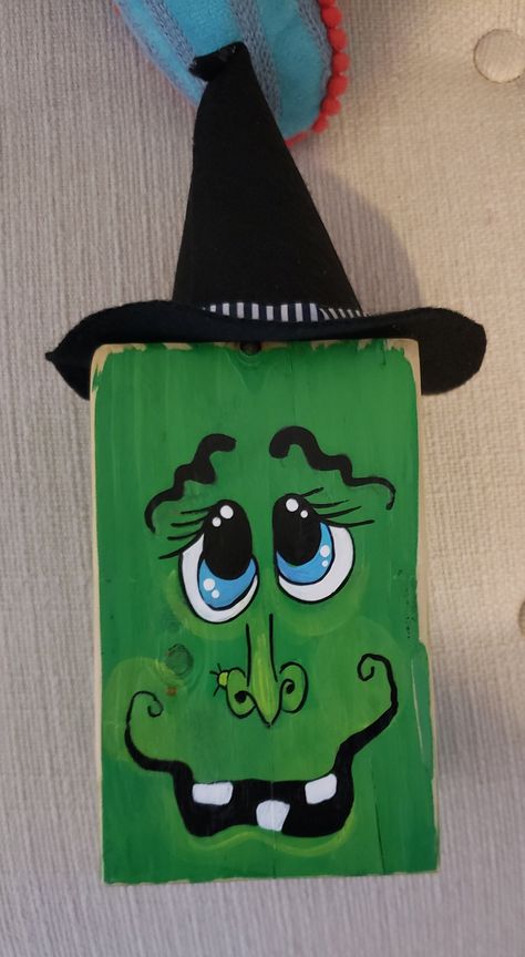 This is a wooden block Witch with handmade felt hat on the top and painted face. Very cute for a tiered tray or shelf sitter or mantel. Painted by myself. Facial expressions may vary as they are hand painted. These blocks are 5 inches high x 3.5 inches wide x 3.5 inches deep. Overall height is 10 inches with hat. Hat is not removeable. Blue eyes. For decorative use only and should not be used as toys. Item is handmade and hand painted, variations may occur in wood with grain, knots. Handmade Felt Hats, Painted Pavers, Hand Painted Wooden Signs, Witch Face, Halloween Decorations Diy Outdoor, Diy Outdoor Decor, Cute Signs, Pallet Art, Fall Halloween Crafts