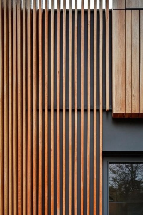 Modern house facade with timber gladding and vertical wood slat panels. The chic, rustic charm of timber-clad houses might just be the trendiest look nobody warned you about. Timber Batten Facade, Wood Panel Facade, Wood Facade Architecture Design, Vertical Louvers Facade, Vertical Timber Cladding, Outdoor Wall Cladding, Wood Cladding Exterior, Nordic Houses, Building Cladding