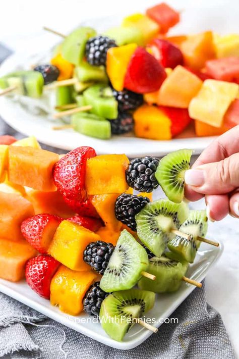 Fruit kabobs are the perfect summer appetizer to serve at a party! Choose your favorite fresh fruits, making them as simple as you want, thread them onto skewers before chilling. These are so easy to make ahead of time and are delicious served with fruit dip! #spendwithpennies #fruitkabobs #fruitskewers #summerrecipes #snack #dessert #appetizer Rainbow Fruit Kabobs, Cheap Party Food, Fruit Salad With Pudding, Easy Make Ahead Appetizers, Easy Fruit Pizza, Summer Salads With Fruit, Make Ahead Appetizers, Fruit Skewers, Spend With Pennies