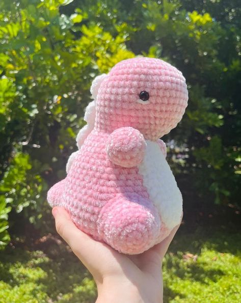 Crochet stuffed animals Unique Crochet Stuffed Animals, Crochet Strawberry Dinosaur, Crochet Pink Dinosaur, Crochet Pink Animal, Crochet Pink Plushies, Chubby Dino Crochet Pattern Free, Pink Crochet Animals, Chubby Dino Crochet Pattern, Simple Crochet Plushies