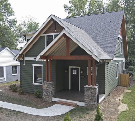 Earth tones add warmth and texture. We love the look of this home in Rifle with mountain sage colored siding, white trim, and stone accents. Green Exterior House Colors, Green House Exterior, Green Siding, Lake Houses Exterior, House Paint Color Combination, Exterior House Paint Color Combinations, James Hardie, Exterior House Color, Cabin Exterior