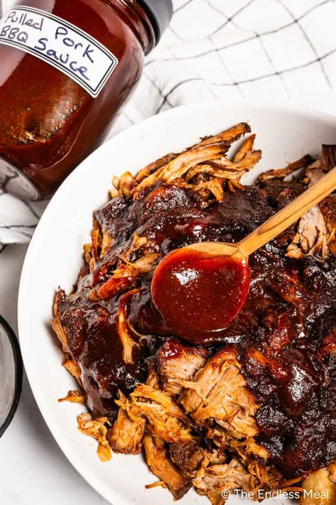 Pork is always tasty, but when it's bathed in a delicious homemade BBQ sauce for pulled pork and then slow-cooked until it falls apart, it ascends to a whole new level! Strands of tender pork are the perfect canvas to soak up the smoky, tangy, sweet, and savory flavors of rich BBQ sauce. Who needs to go to a smokehouse when you can make a hickory BBQ sauce in your own kitchen?! #theendlessmeal #bbqsauce #pulledpork #pork #bbqpork #sauce Pulled Pork Bbq Sauce Recipe, Pork Bbq Sauce Recipe, Bbq Sauce For Pulled Pork, Pulled Pork Sauce Recipe, Sauce For Pulled Pork, Pulled Pork Bbq Sauce, Pulled Pork Sauce, Pulled Pork Enchiladas, Bbq Sauce Homemade Easy