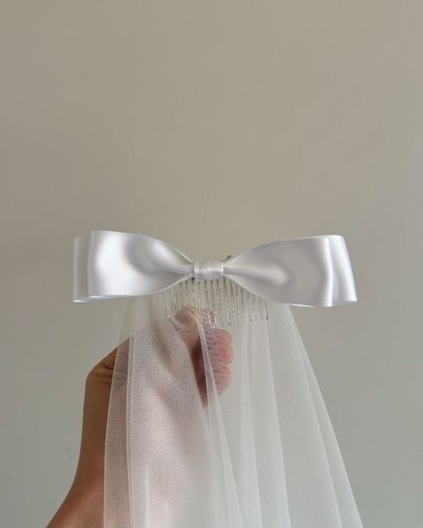 Had to get this cute bow veil up on the gram! 🎀 This is the Estelle medium length veil with a white ribbon stacked bow, all handmade 🤍 #bowveil #2025bridetobe #bridetobe #veil Wedding Veil With Bow, Medium Length Veil, Veil With Bow, Bow Veil, Cute Bow, White Ribbon, Wedding Veil, Cute Bows, Medium Length